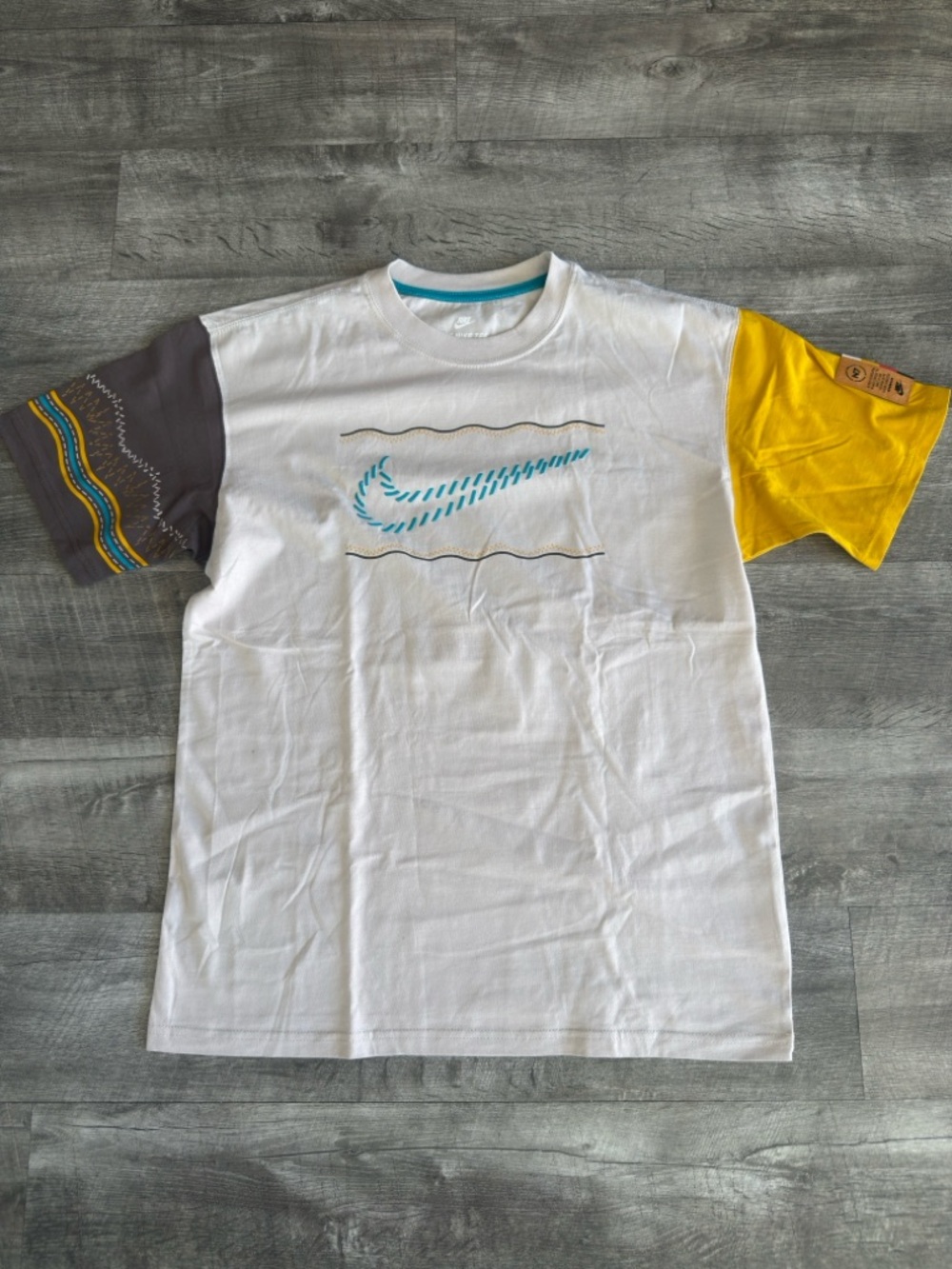 Nike Cream Tee with Yellow & Gray Contrast Sleeves and Teal Swoosh